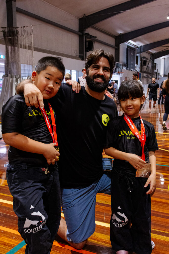 photo at the competition with head coach diego from journey jiu jitsu